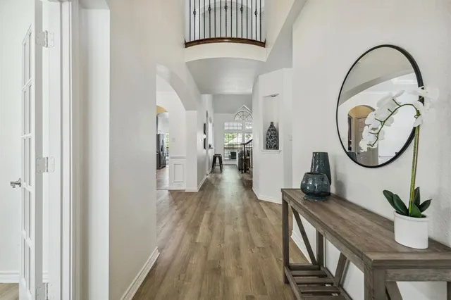 a view of a hallway with seating area