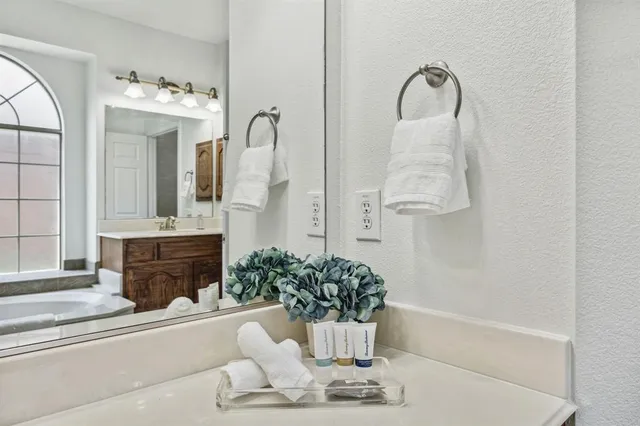 a view of a room with furniture and window