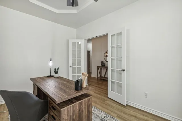 a view of kitchen island with furniture and wooden floor
