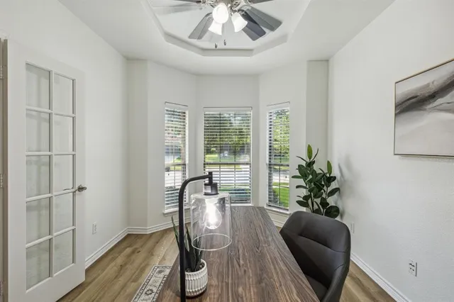 a view of a livingroom with furniture window and wooden floor