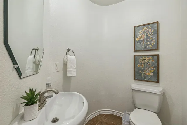 a bathroom with a toilet and a sink