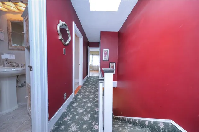 a view of a livingroom and a hallway