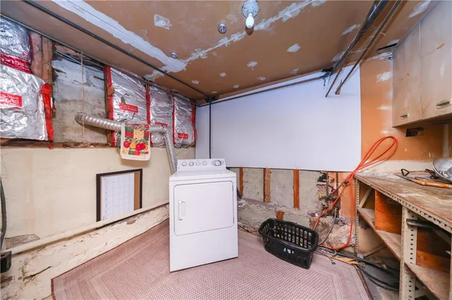 a storage room with washer and dryer