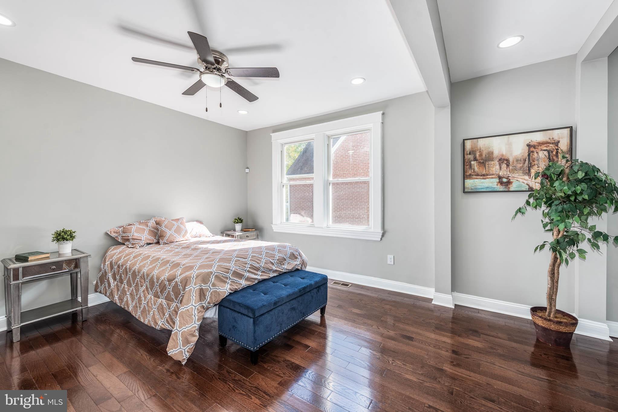 4001 Ridgecroft Road Baltimore, MD 21206 - Photo 10 of 35 a bed sitting in a spacious bedroom next to a window