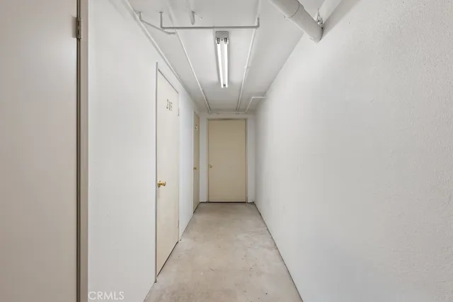 a view of a hallway with a white walls