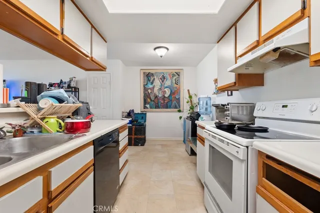 a view of living room with furniture and large window