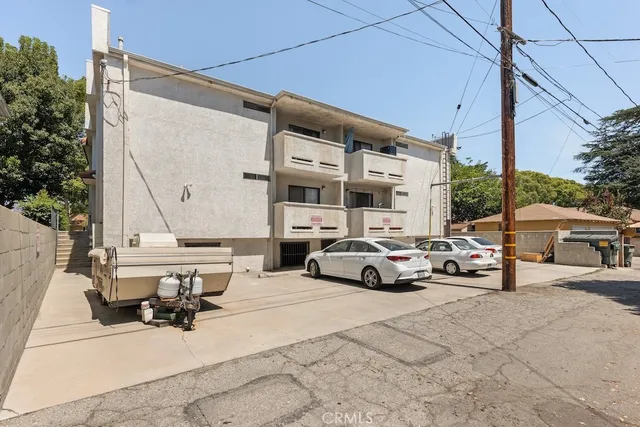 a view of street with parked cars