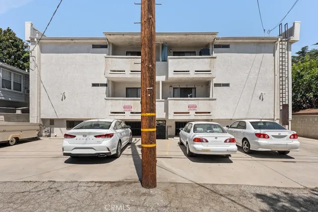 a white building covered with tall buildings