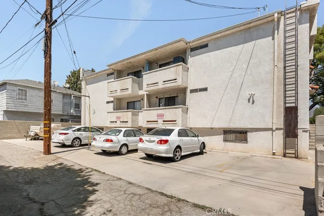 a cars parked in front of a building