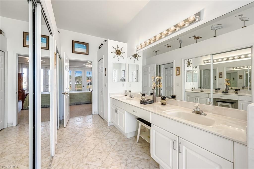 598 Grand Rapids Boulevard Naples, FL 34120 - Photo 20 of 49 owners suite, dual closets, dual sinks with vanity area