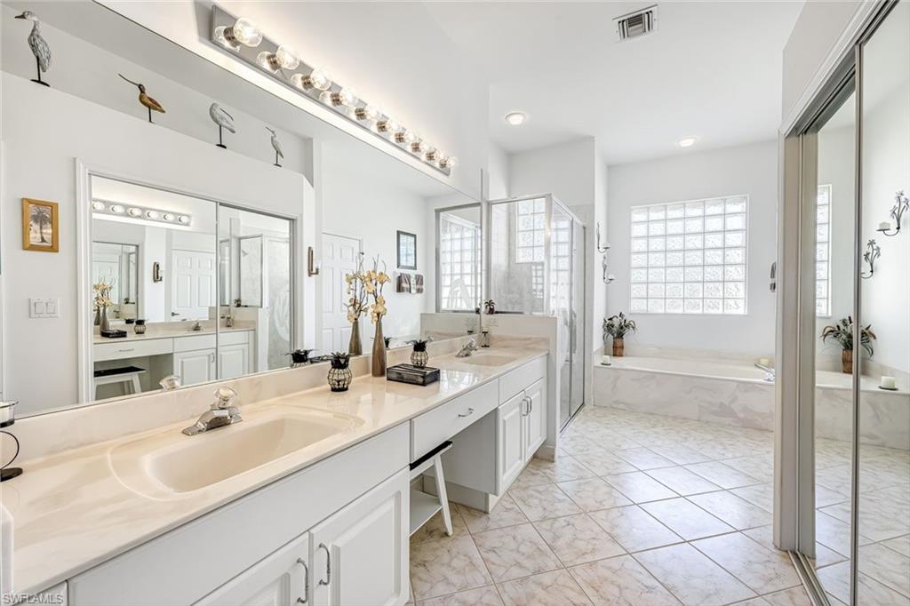 598 Grand Rapids Boulevard Naples, FL 34120 - Photo 21 of 49 This bathroom has all the space you could need!