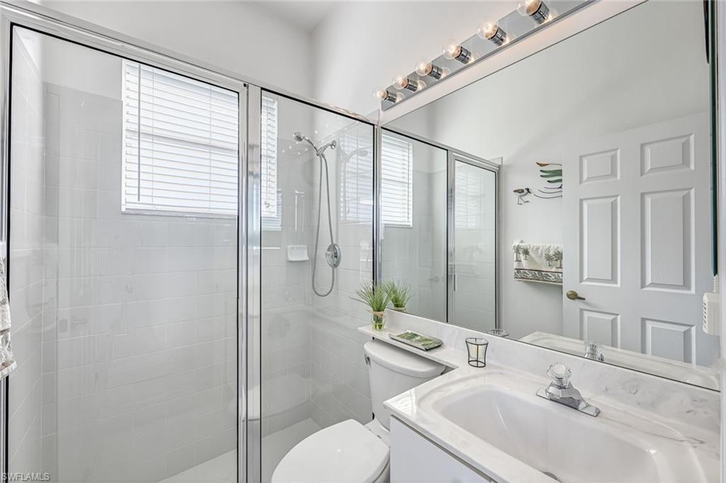598 Grand Rapids Boulevard Naples, FL 34120 - Photo 27 of 49 3rd bath, off pocketed door/ private separate area (with 4th bedroom and out door access point)