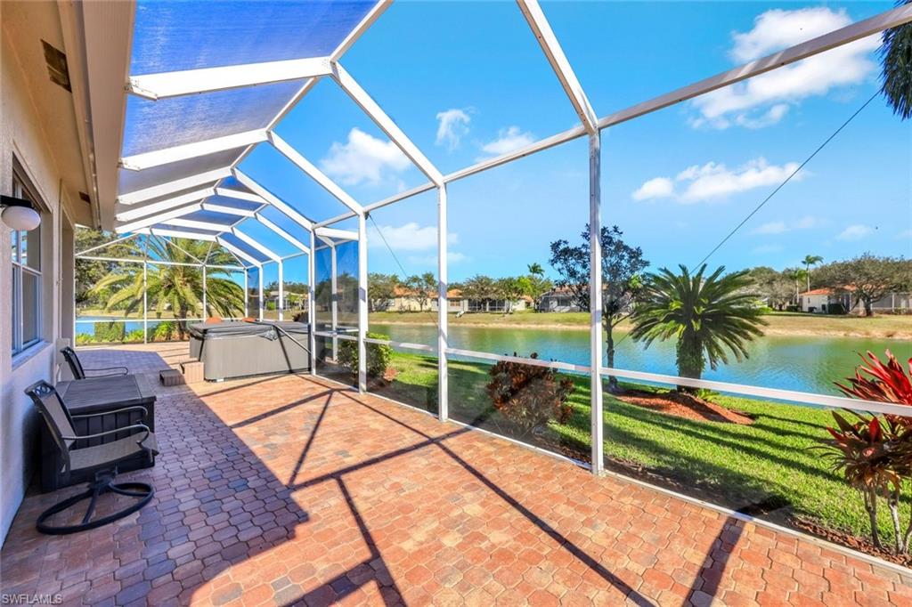 598 Grand Rapids Boulevard Naples, FL 34120 - Photo 31 of 49 screened lanai area off the 4th bedroom/with full bath and separate entrance/exit for guests privacy