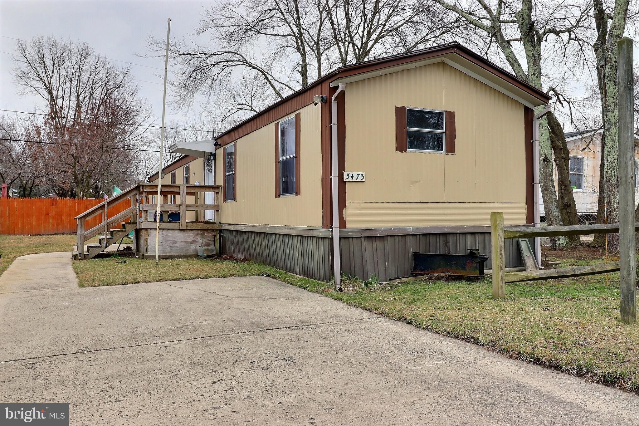 a house that has a tree in front of the house