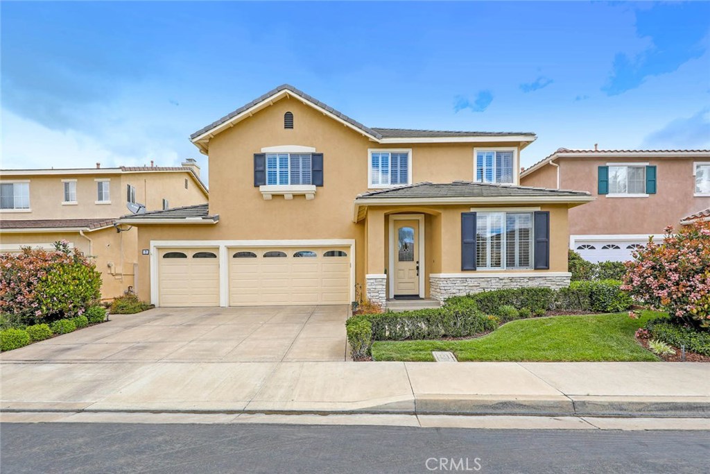 7 Washington Irvine, CA 92606 - Photo 1 of 1 a front view of a house with a yard and garage