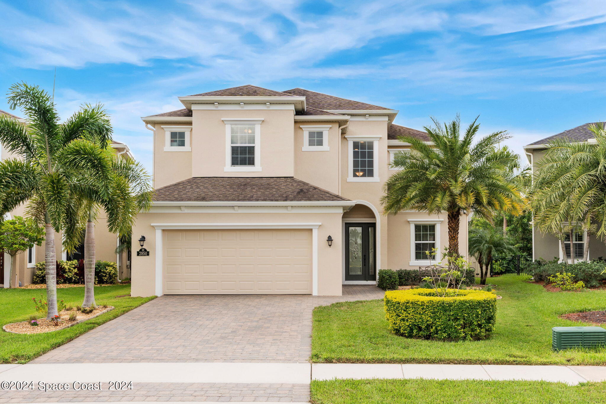 2850 Amethyst Way Melbourne, FL 32940 - Photo 1 of 37 a front view of a house with a garden