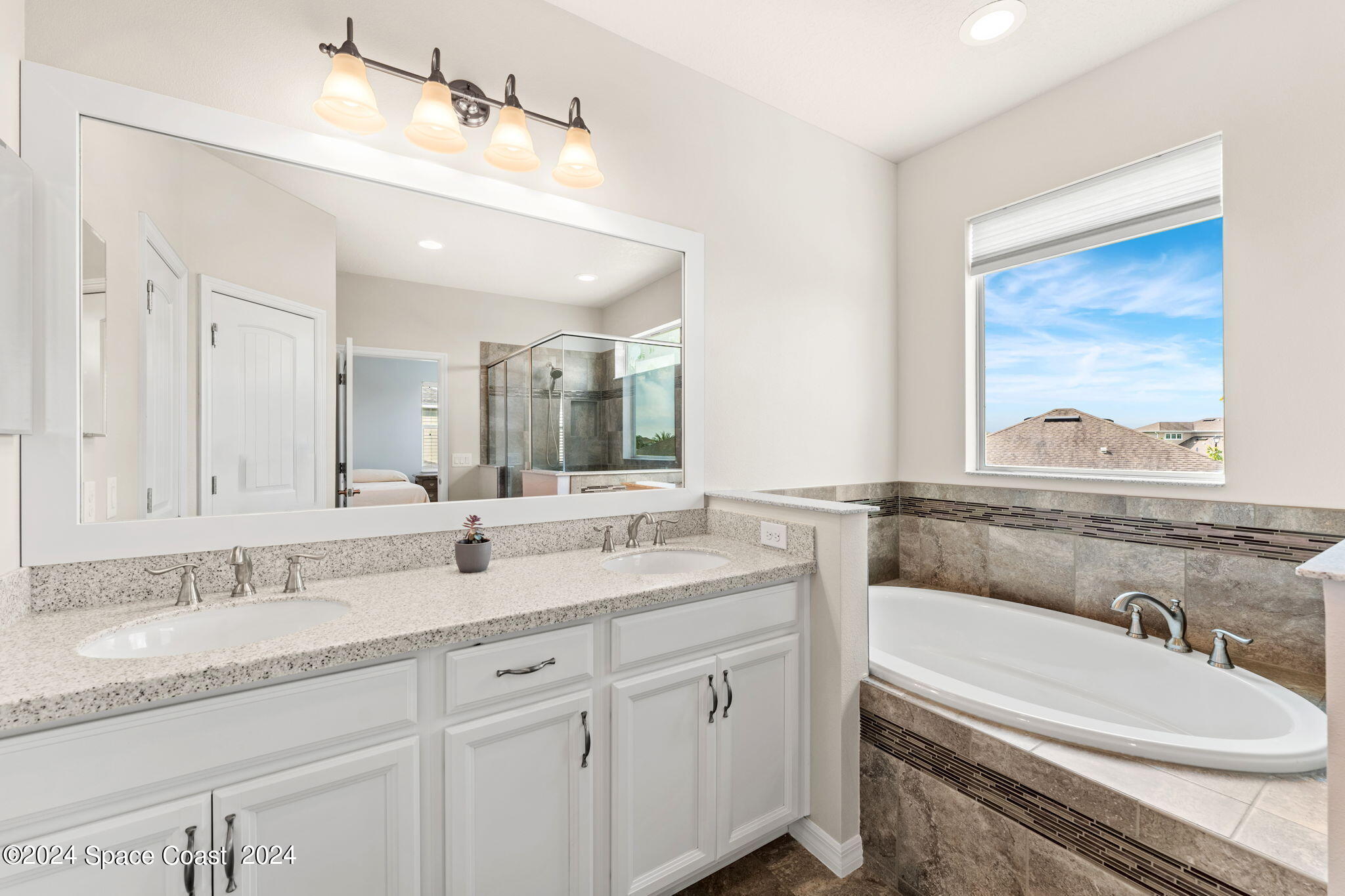 2850 Amethyst Way Melbourne, FL 32940 - Photo 15 of 37 a bathroom with a granite countertop sink mirror and double