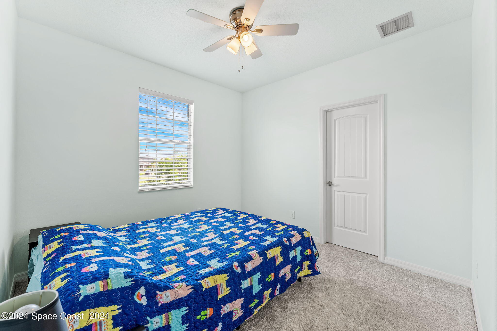 2850 Amethyst Way Melbourne, FL 32940 - Photo 17 of 37 a bedroom with a bed and a window