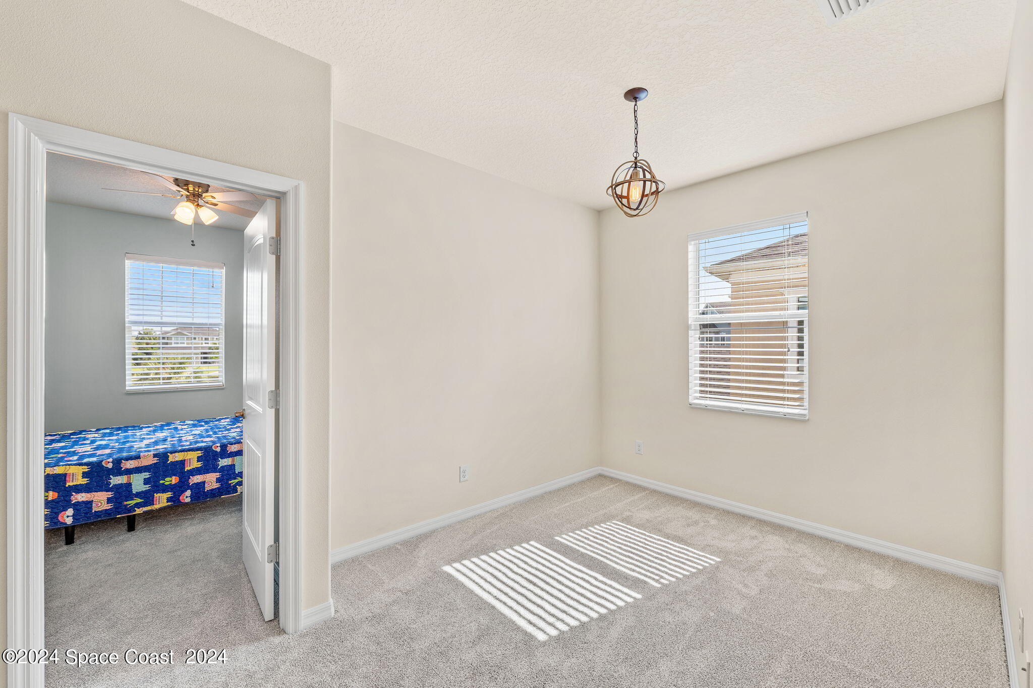 2850 Amethyst Way Melbourne, FL 32940 - Photo 18 of 37 a view of livingroom with hardwood floor and a window