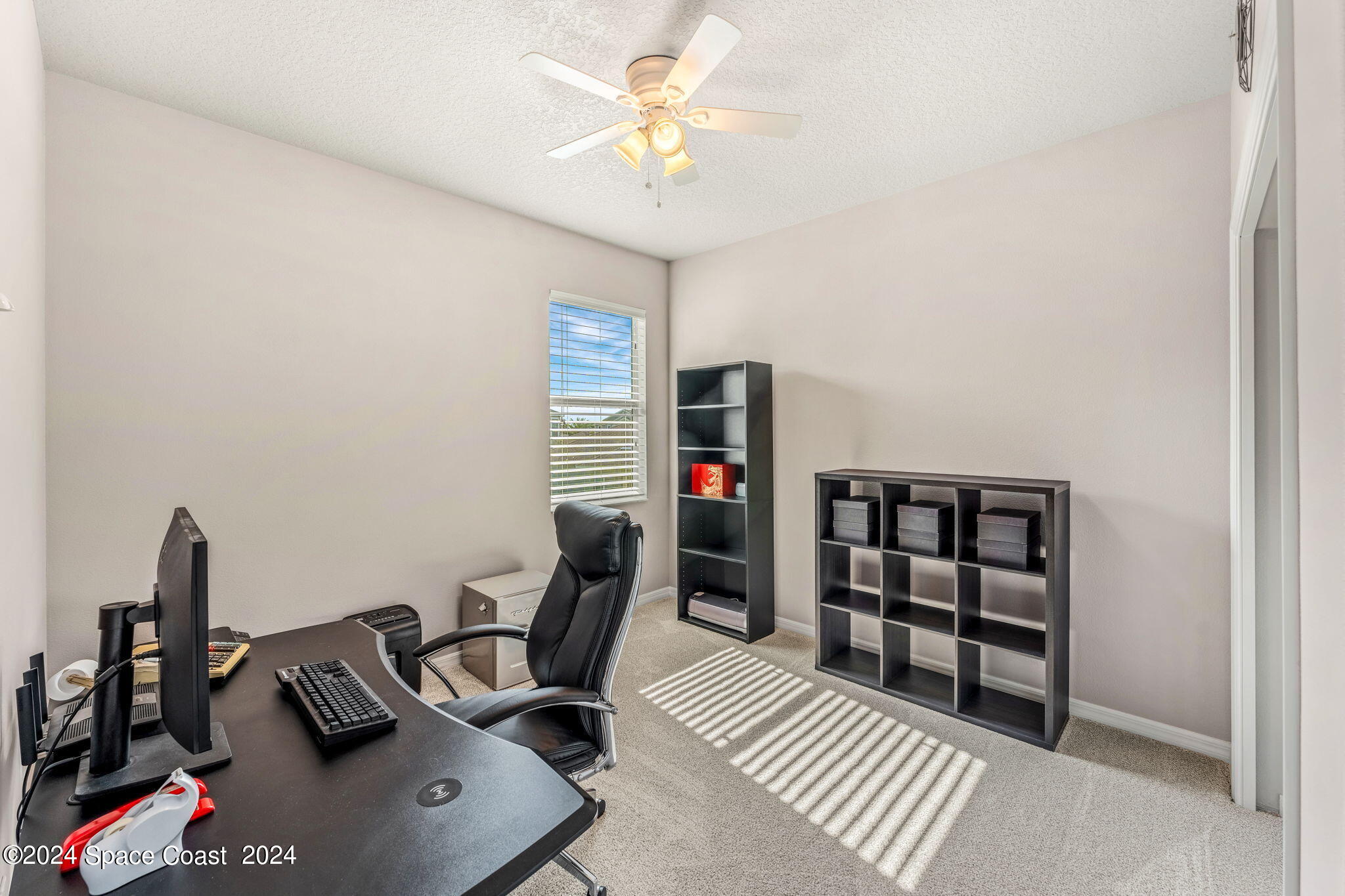2850 Amethyst Way Melbourne, FL 32940 - Photo 20 of 37 a view of a workspace with furniture and a window