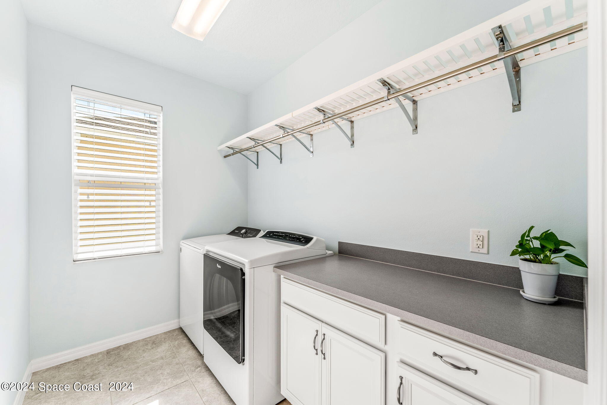 2850 Amethyst Way Melbourne, FL 32940 - Photo 22 of 37 a view of a storage and utility room with a window