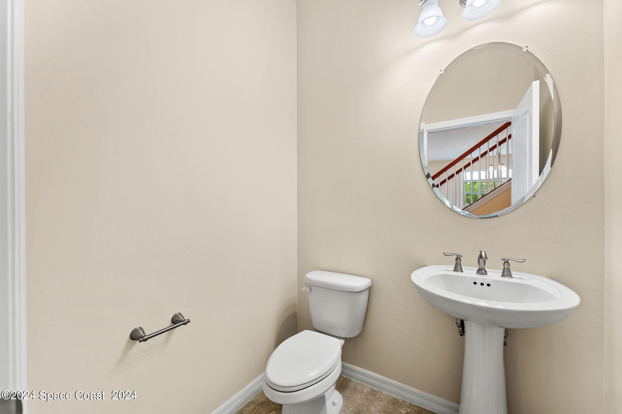 2850 Amethyst Way Melbourne, FL 32940 - Photo 23 of 37 a bathroom with a sink mirror and toilet