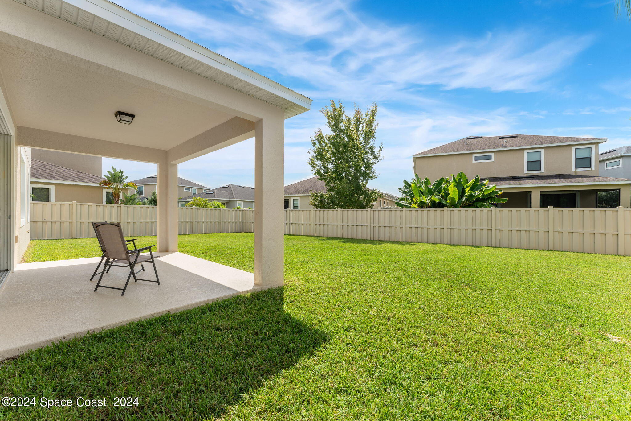 2850 Amethyst Way Melbourne, FL 32940 - Photo 24 of 37 a view of a backyard with a garden and plants