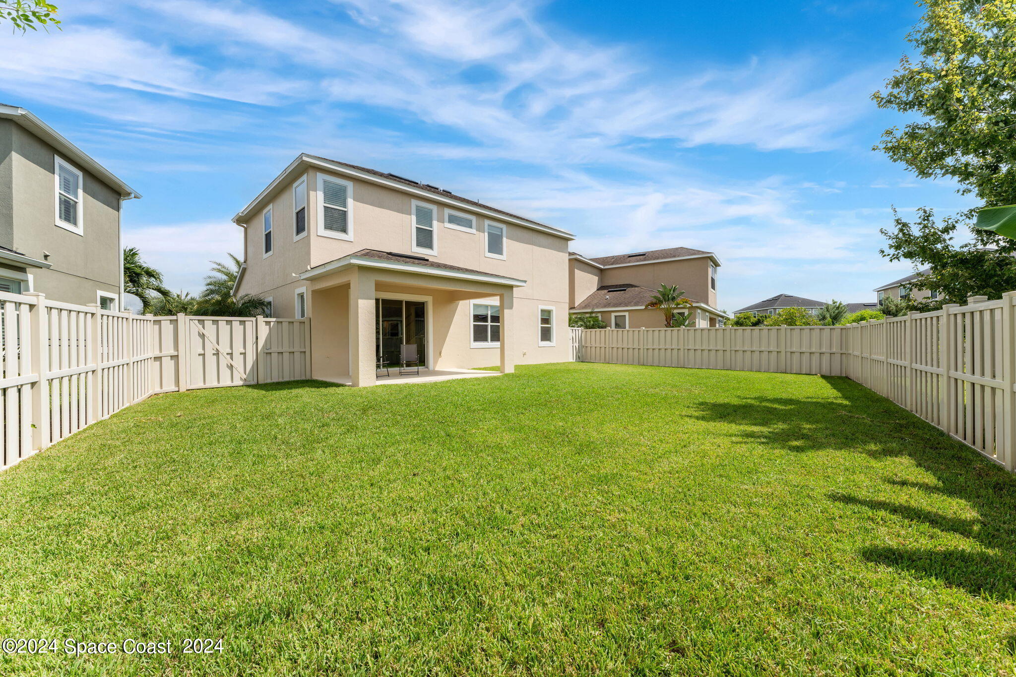 2850 Amethyst Way Melbourne, FL 32940 - Photo 27 of 37 a view of a house with a yard and a garden
