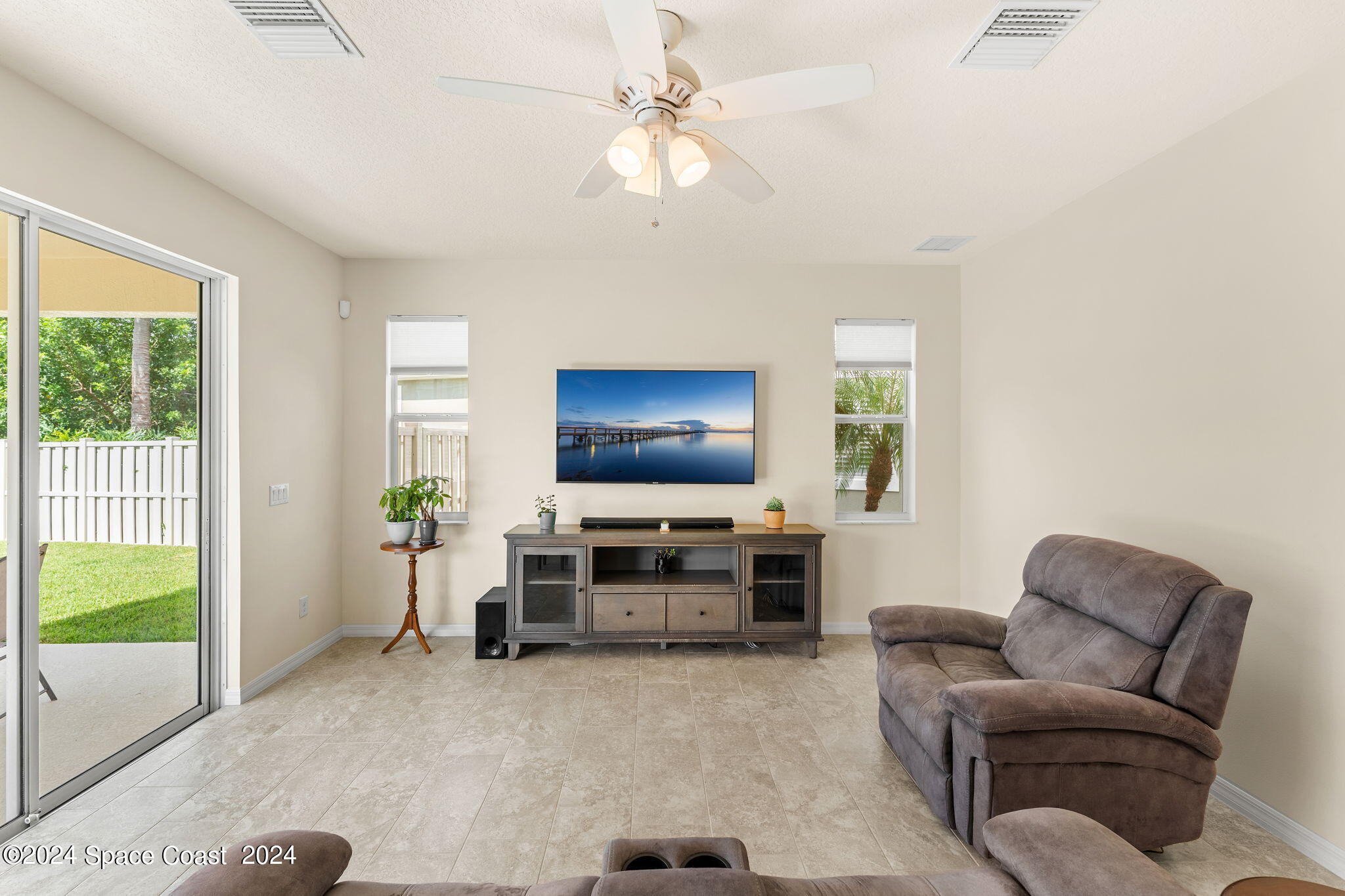 2850 Amethyst Way Melbourne, FL 32940 - Photo 4 of 37 a living room with furniture and a flat screen tv