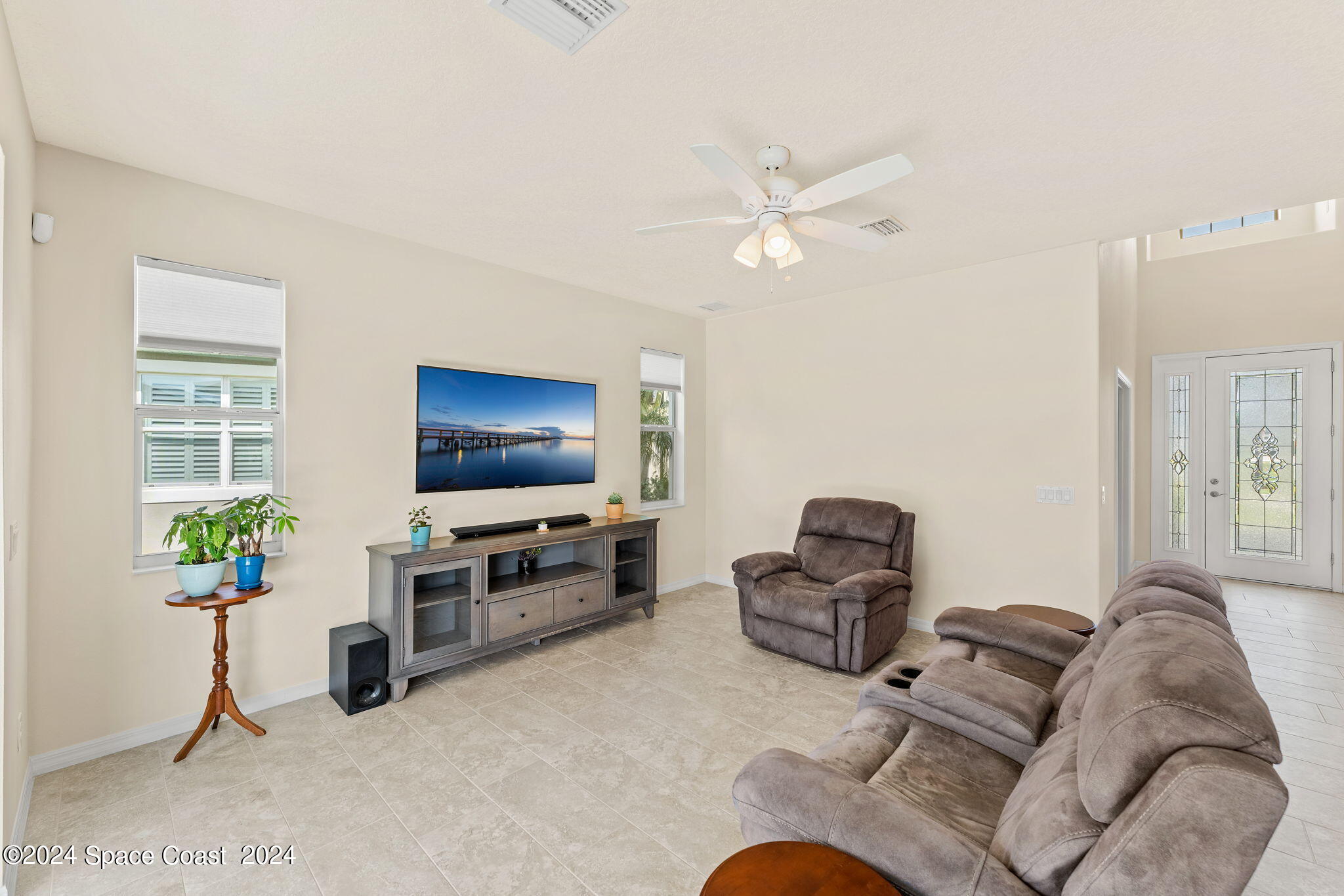 2850 Amethyst Way Melbourne, FL 32940 - Photo 5 of 37 a living room with furniture and a flat screen tv