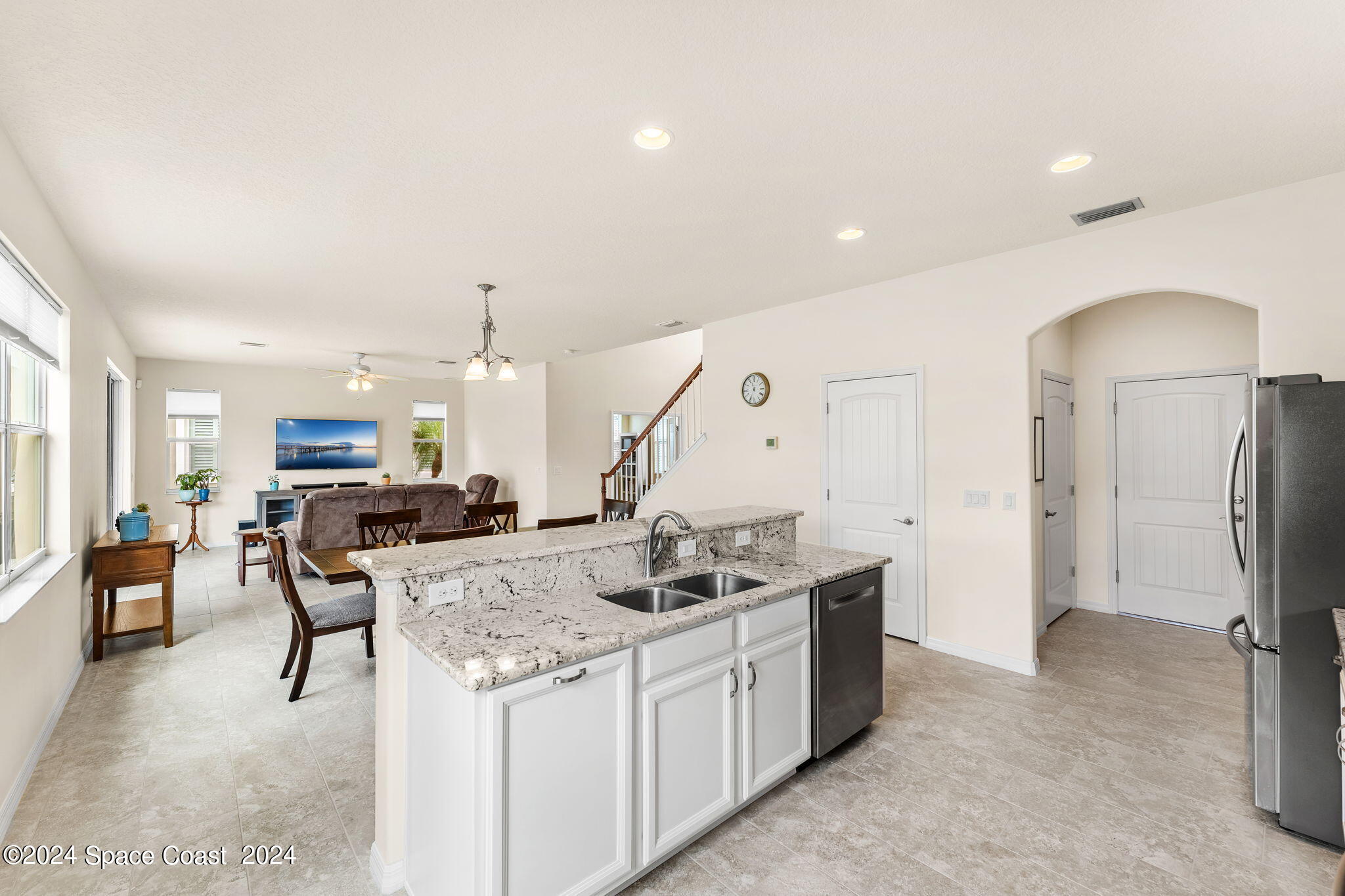 2850 Amethyst Way Melbourne, FL 32940 - Photo 8 of 37 a kitchen with stainless steel appliances granite countertop a sink a stove and a refrigerator
