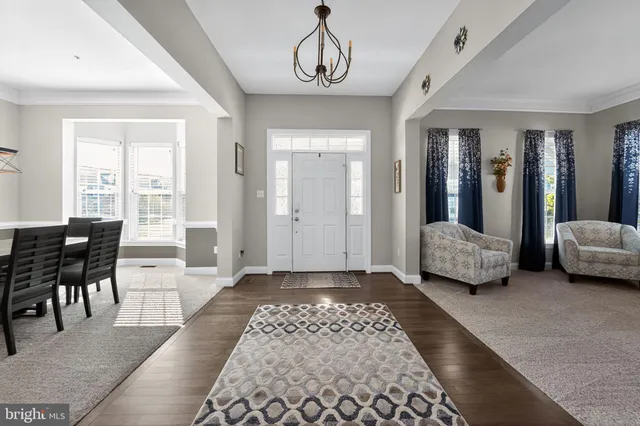 a living room with a couch and a dresser