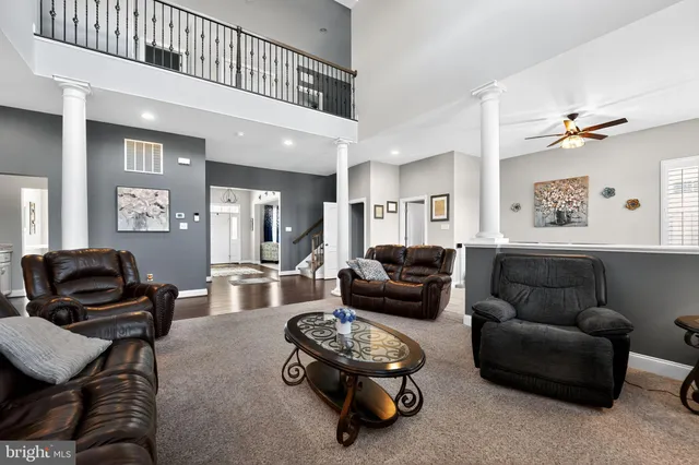 a kitchen with a sink cabinets and wooden floor