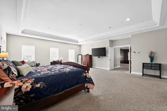 a bedroom with a bed and a desk