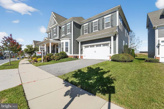 a front view of house with yard and outdoor seating