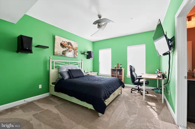 a bathroom with a sink toilet vanity and shower