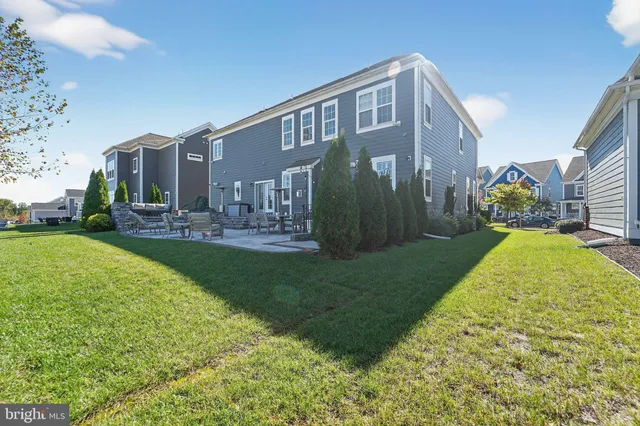 a view of a house with backyard porch and sitting area