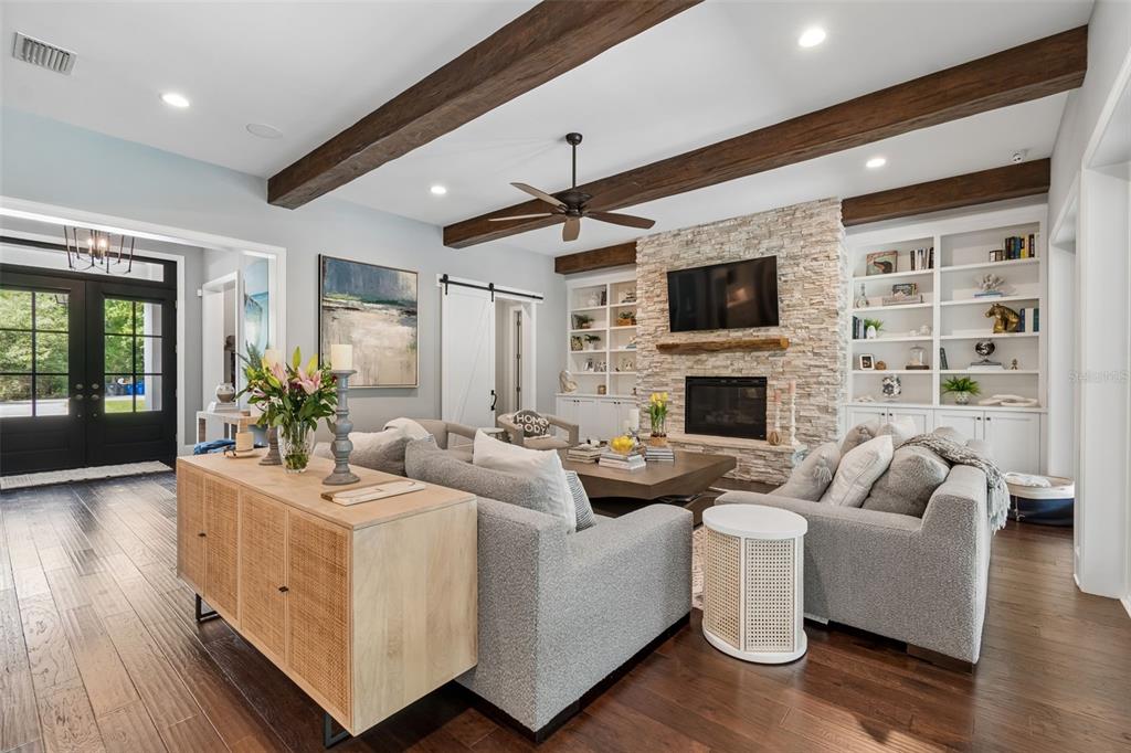 17001 Midas Lane Lutz, FL 33549 - Photo 12 of 100 a living room with furniture fireplace and a flat screen tv