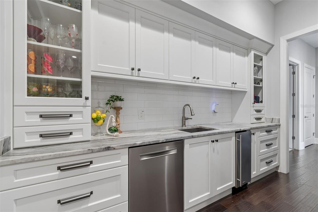 17001 Midas Lane Lutz, FL 33549 - Photo 25 of 100 a kitchen with stainless steel appliances granite countertop a sink and a stove next to a window