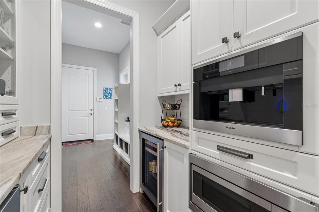 17001 Midas Lane Lutz, FL 33549 - Photo 28 of 100 a kitchen with stainless steel appliances a stove microwave and sink