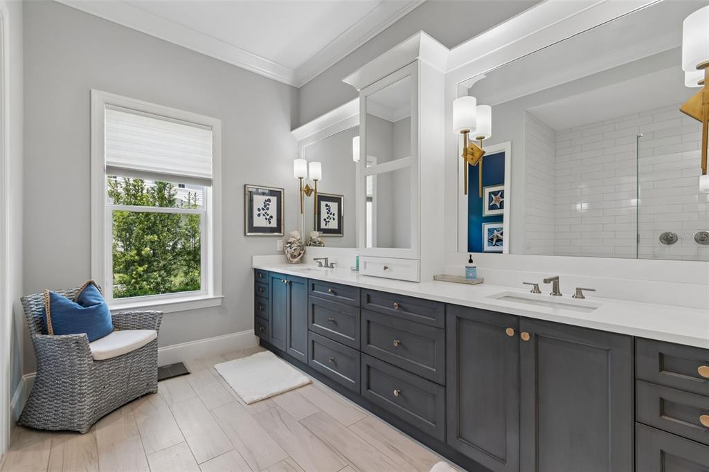 17001 Midas Lane Lutz, FL 33549 - Photo 37 of 100 a spacious bathroom with a double vanity sink a large mirror and a bathtub