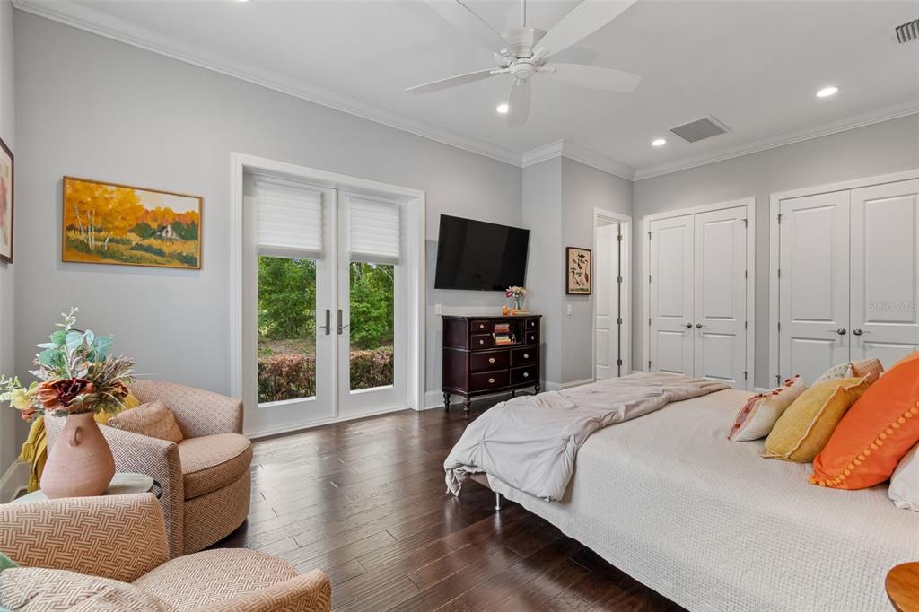 17001 Midas Lane Lutz, FL 33549 - Photo 44 of 100 a bedroom with a bed couch and a flat tv screen
