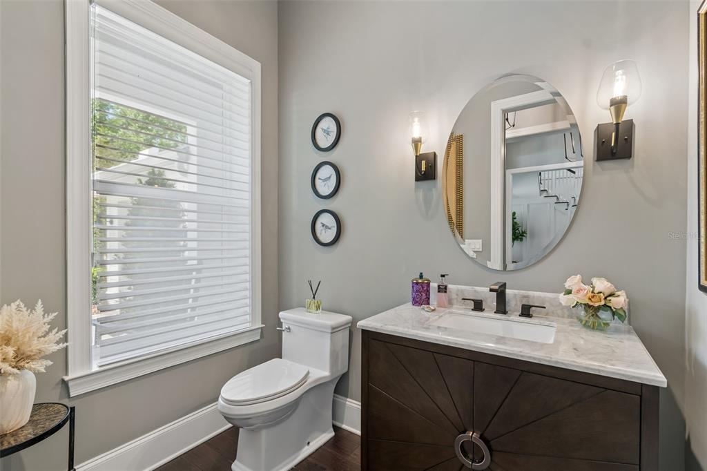 17001 Midas Lane Lutz, FL 33549 - Photo 49 of 100 a bathroom with a toilet sink and mirror