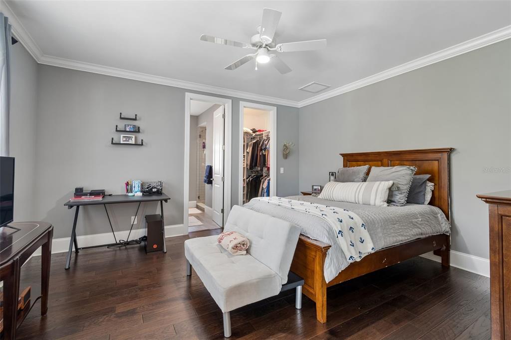 17001 Midas Lane Lutz, FL 33549 - Photo 55 of 100 a bedroom with a bed and a table in it