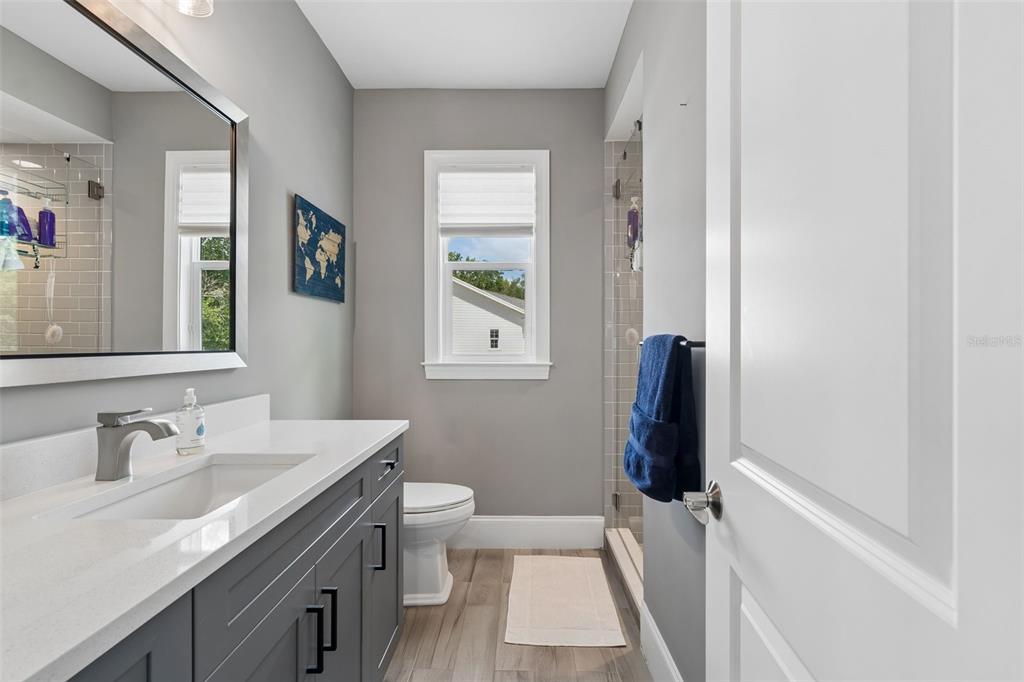 17001 Midas Lane Lutz, FL 33549 - Photo 57 of 100 a bathroom with a sink a toilet and shower