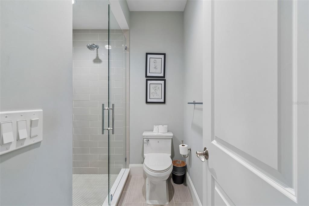 17001 Midas Lane Lutz, FL 33549 - Photo 65 of 100 a white toilet sitting next to a bathroom sink