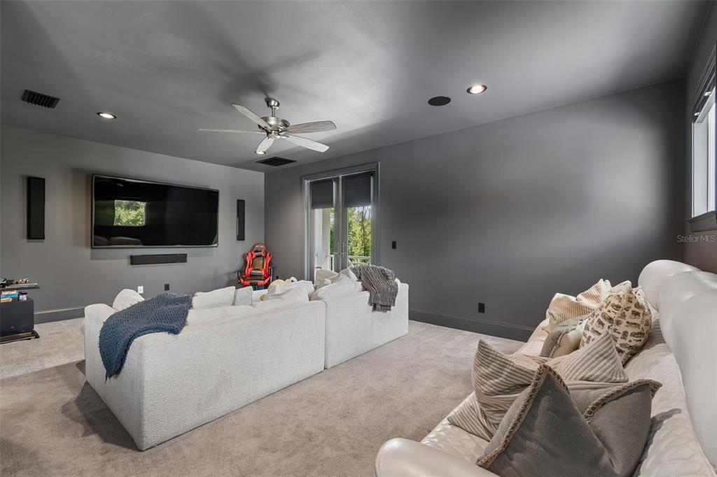 17001 Midas Lane Lutz, FL 33549 - Photo 67 of 100 a living room with furniture and a flat screen tv