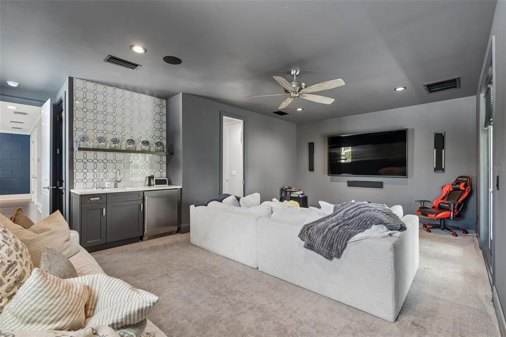 17001 Midas Lane Lutz, FL 33549 - Photo 68 of 100 a living room with furniture and a flat screen tv