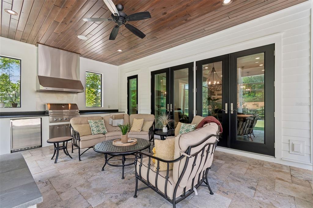 17001 Midas Lane Lutz, FL 33549 - Photo 75 of 100 a living room with furniture a flat screen tv and a large window
