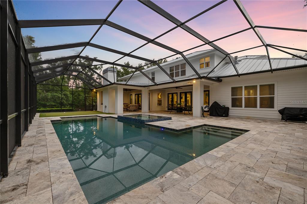17001 Midas Lane Lutz, FL 33549 - Photo 82 of 100 a view of a patio with a table and chairs
